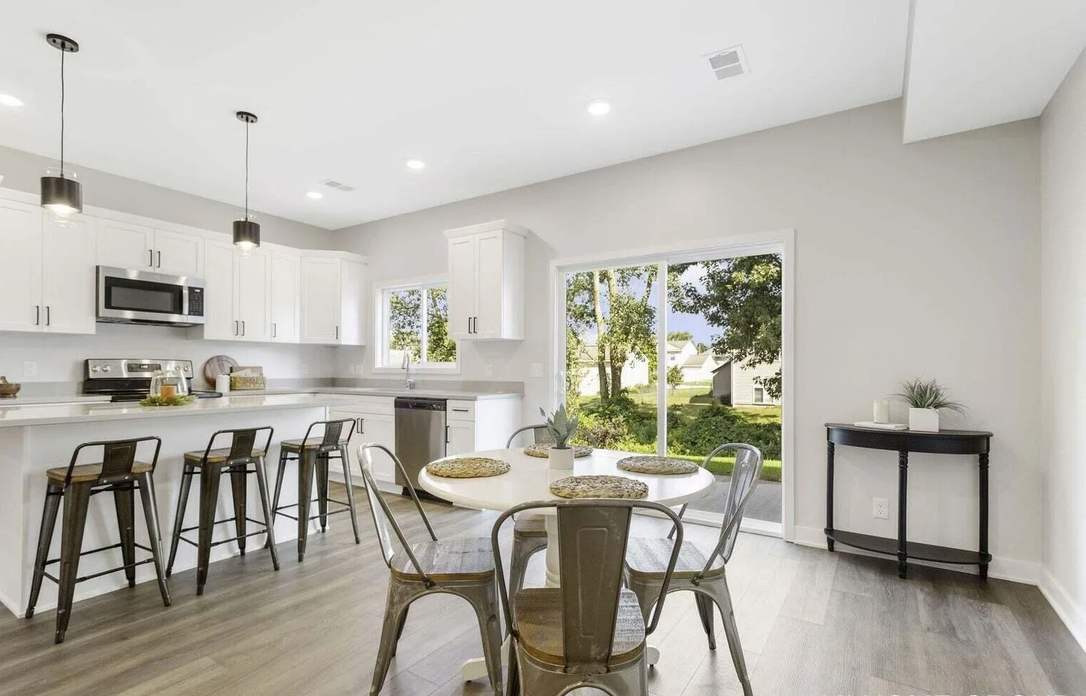 Open kitchen and dining area at Signature Estates